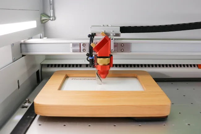 Laser engraving of glass and wood in one step