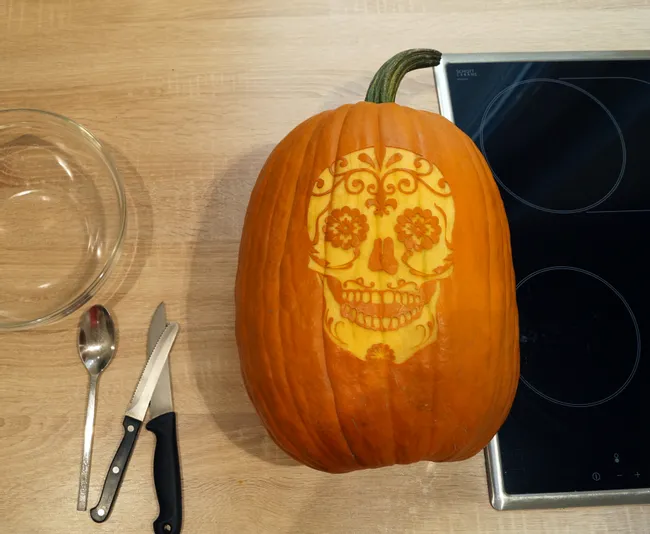 get a knife and a spoon to hollow the pumpkin