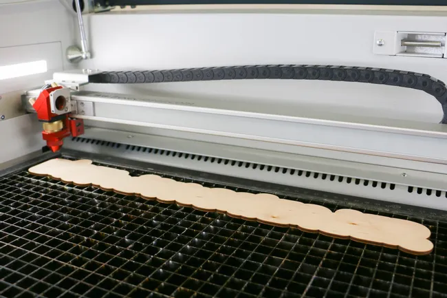 Laser cutting the wooden baseplate